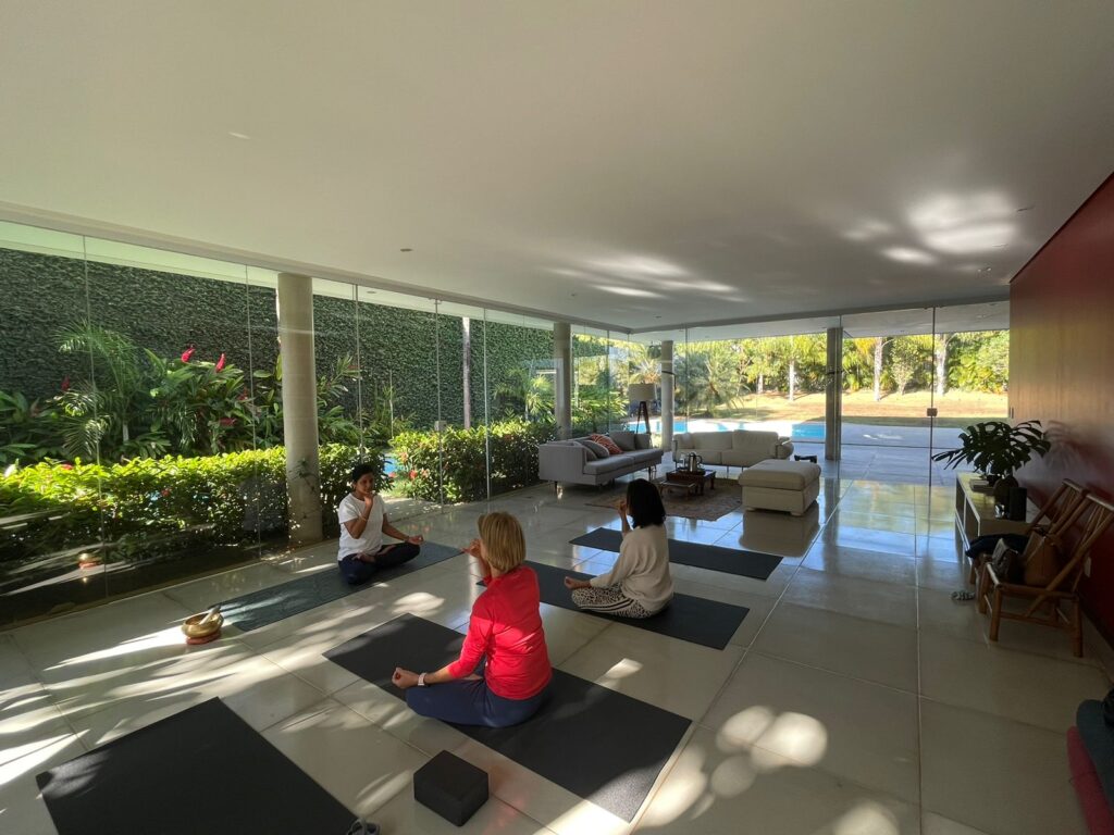 Yoga instructor guiding student for Pranayama